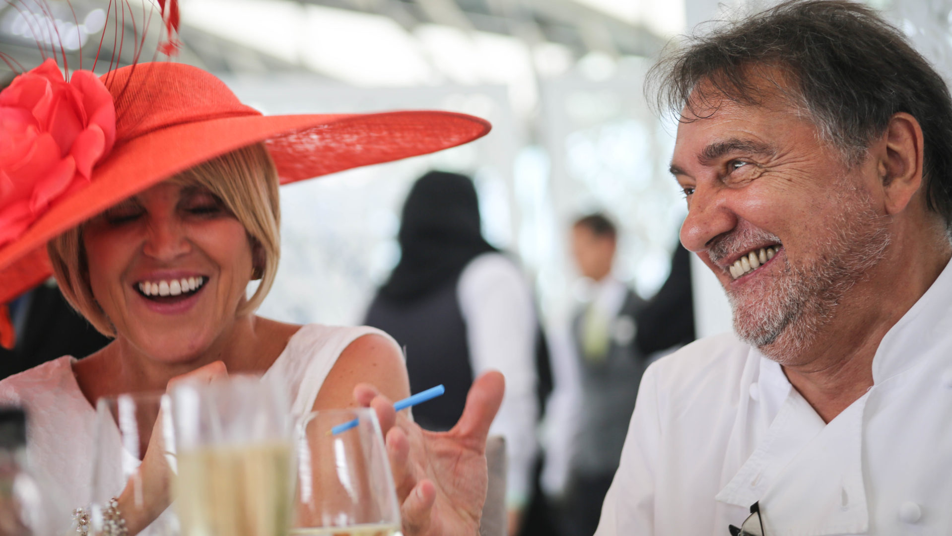 Raymond Blanc laughing with guest at Royal Ascot